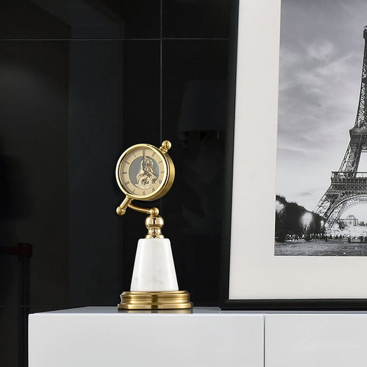 Reloj dorado con base de Marmol