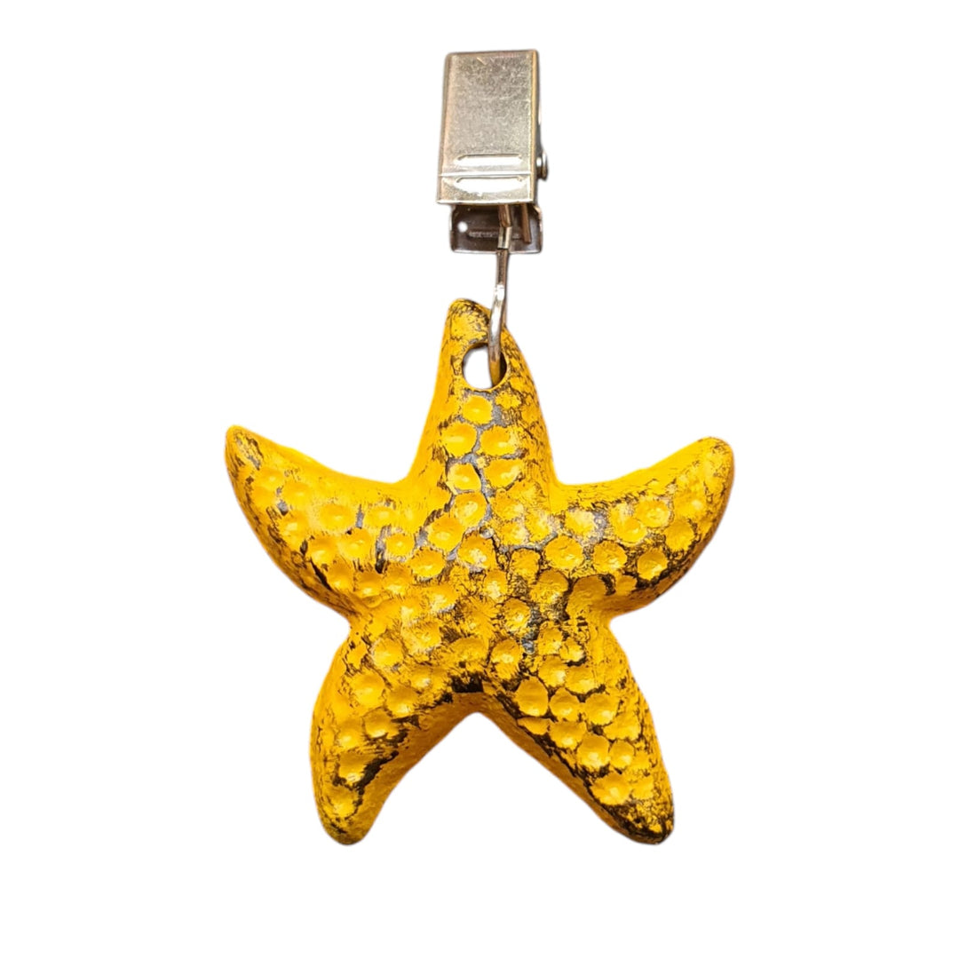 Sujeta Mantel Estrella color Amarilla de hierro