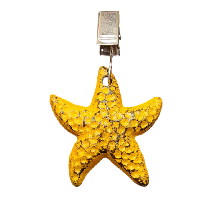 Sujeta Mantel Estrella color Amarilla de hierro