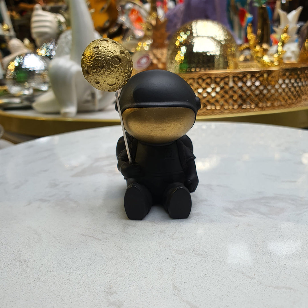 Astronauta Sentado Negro con dorado CASONA DECO