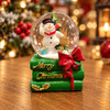 Esfera Navideña Muñeco de Nieve sobre Libros