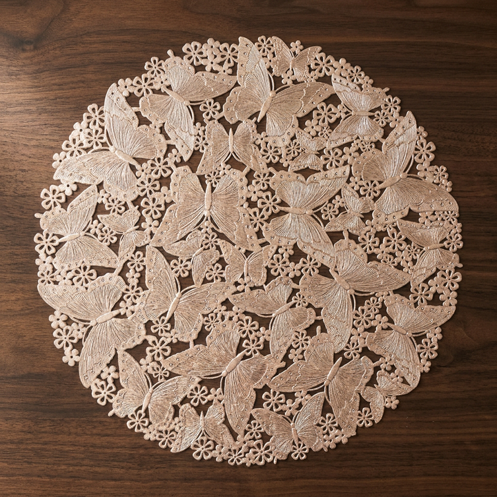 Individual de mesa calado con mariposas en oro rosa
