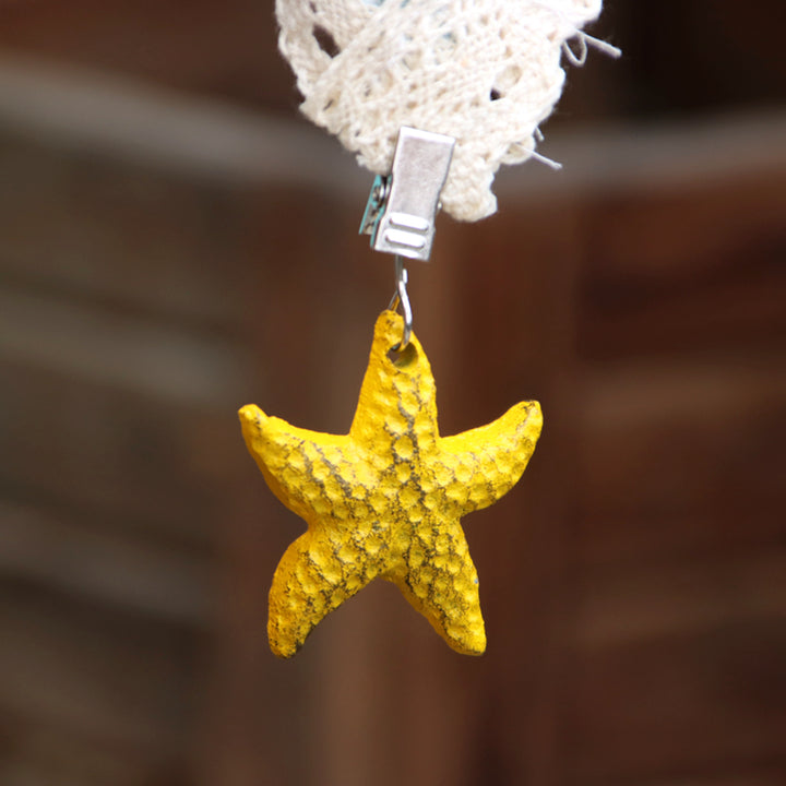 Sujeta Mantel Estrella color Amarilla de hierro